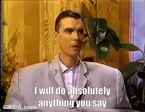 A Man In A Suit Says That He Will Do Absolutely Anything You Say GIF