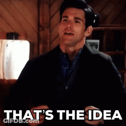 A Man In A Suit Says That 'S The Idea In Front Of A Wooden Wall GIF