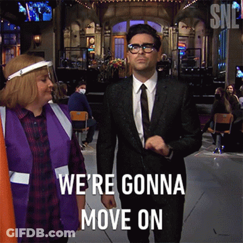 A Man In A Suit Says We 'Re Gonna Move On While Walking GIF