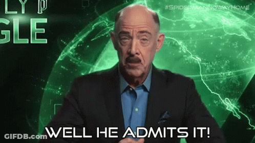 A Man In A Suit Says Well He Admits It In Front Of A Green Background GIF