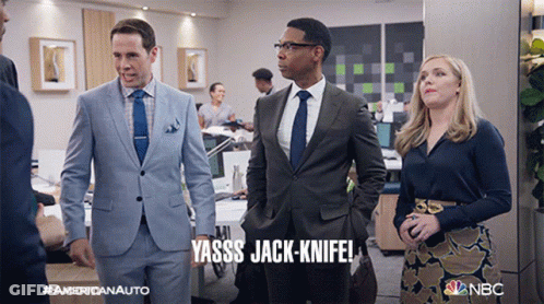 A Man In A Suit Says Yasss Jack-Knife In An Office GIF