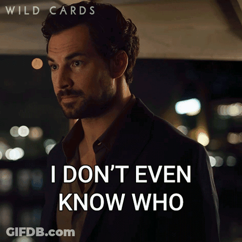 A Man In A Suit Says " You Are Anymore " In Front Of A Sign That Says Wild Cards GIF