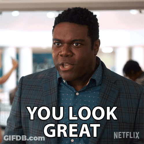 A Man In A Suit Says You Look Great In A Netflix Ad GIF