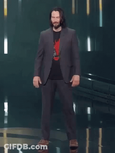 A Man In A Suit Says You 'Re Breathtaking While Standing On A Stage GIF