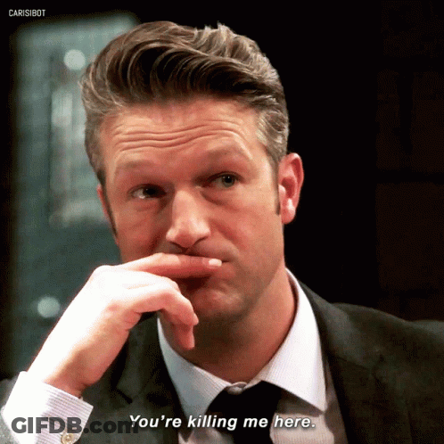 A Man In A Suit Says You 'Re Killing Me Here GIF