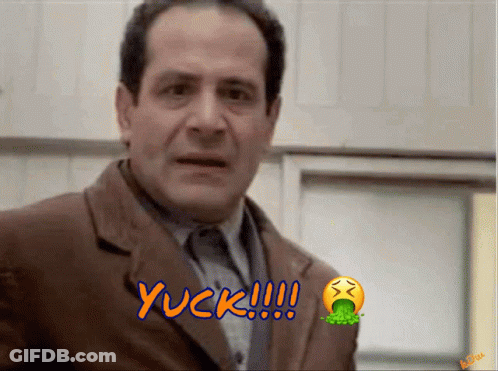 A Man In A Suit Says Yuck With A Smiley Face GIF
