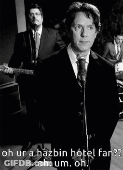 A Man In A Suit Singing Into A Microphone With The Words Oh Ur A Hazbin Hotel Fan Below Him GIF
