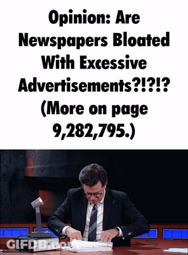 A Man In A Suit Sits At A Desk With A Sign That Says Opinion Are Newspapers Bloated With Excessive Advertisement GIF