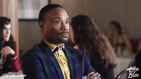 A Man In A Suit Sits At A Table With The Words Like A Boss Written On The Bottom GIF