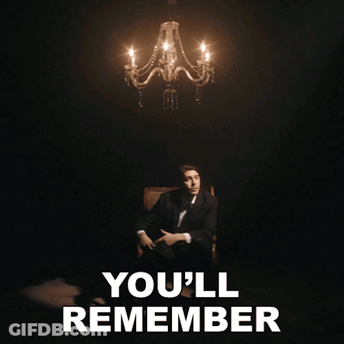 A Man In A Suit Sits In Front Of A Chandelier With The Words " Where You Are " GIF