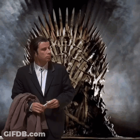 A Man In A Suit Sits In Front Of A Throne GIF