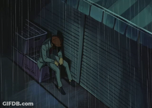 Man In Suit Sitting In Rain Next To Recycle Bin GIF