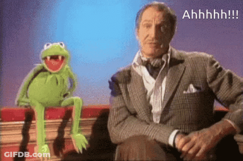 A Man In A Suit Sits Next To A Kermit The Frog GIF