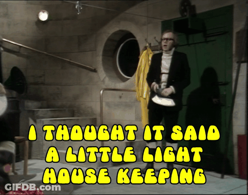 A Man In A Suit Stands In A Room With The Words A Thought It Said A Little Light House Keeping Above Him GIF