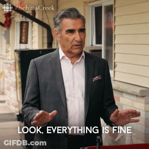 A Man In A Suit Stands In Front Of A Building And Says Look Everything Is Fine GIF