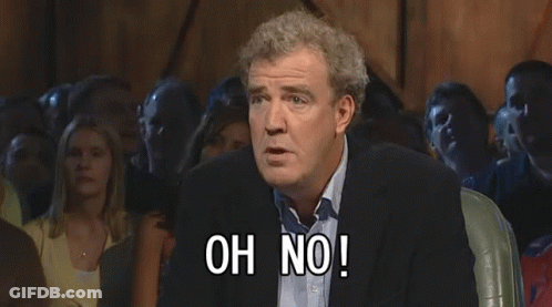 A Man In A Suit Stands In Front Of A Crowd And Says Anyway GIF