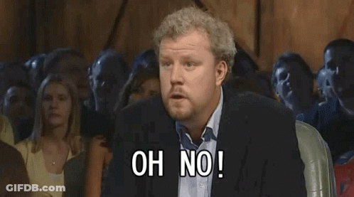 A Man In A Suit Stands In Front Of A Crowd And Says Anyway GIF