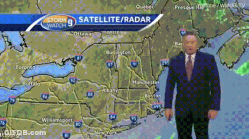 A Man In A Suit Stands In Front Of A Map That Says Storm Watch 9 Satellite Radar GIF