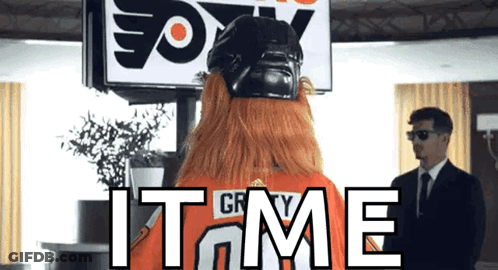 A Man In A Suit Stands In Front Of A Sign That Says " Fox " GIF