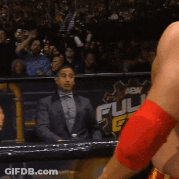 A Man In A Suit Stands In Front Of A Sign That Says " Full " GIF