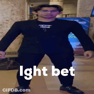 A Man In A Suit Stands In Front Of A Sign That Says ' Ight Bet ' On It GIF