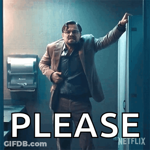 A Man In A Suit Stands In Front Of A Sign That Says Please On It GIF