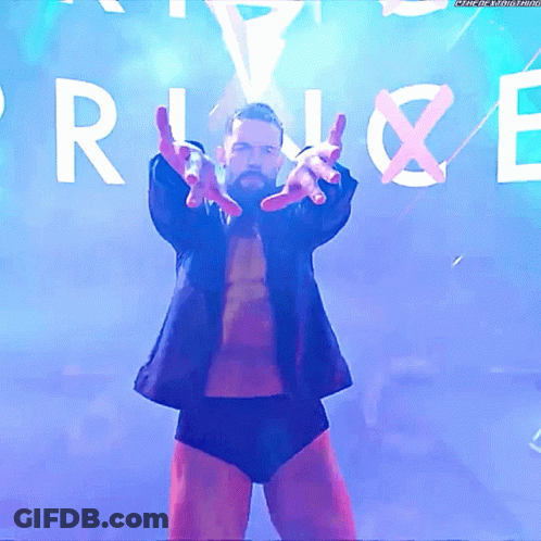 A Man In A Suit Stands In Front Of A Sign That Says " Rise " GIF