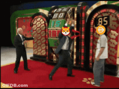 A Man In A Suit Stands In Front Of A Slot Machine With The Number 85 On It GIF