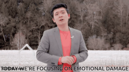 A Man In A Suit Stands In Front Of A Snowy Field With The Words Today We 'Re Focusing On Emotional Damage Below Him GIF
