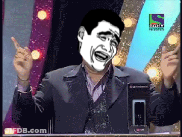 A Man In A Suit Stands In Front Of A Sony Television Sign GIF