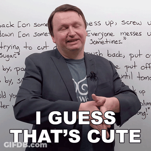 A Man In A Suit Stands In Front Of A White Board That Says " I Guess That 'S Cute " GIF
