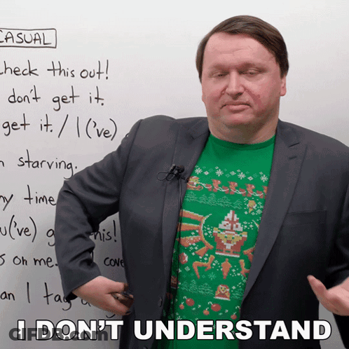 A Man In A Suit Stands In Front Of A White Board With Casual Written On It GIF