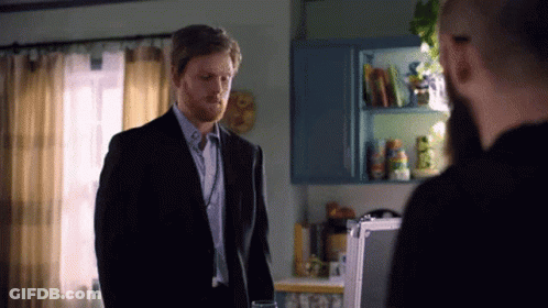 Man In Suit Standing In Front Of Whiteboard GIF