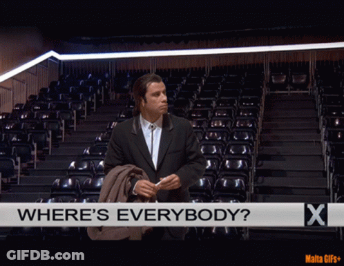 A Man In A Suit Stands In Front Of An Empty Auditorium With The Words Where 'S Everybody GIF