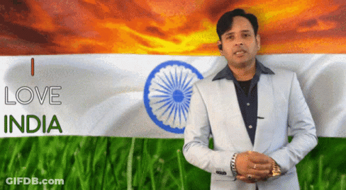 A Man In A Suit Stands In Front Of An Indian Flag And Says I Love India GIF