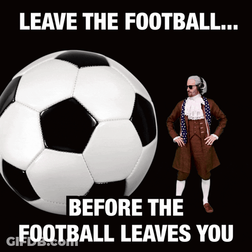 A Man In A Suit Stands Next To A Soccer Ball With The Words " Leave The Football Before The Football Leaves You " GIF