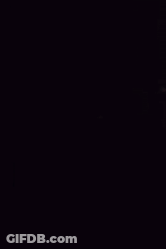 A Man In A Suit Stands Next To Another Man In A Tie GIF