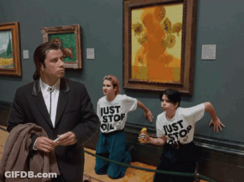 A Man In A Suit Stands Next To Two Children Wearing Shirts That Say Just Stop Oil GIF