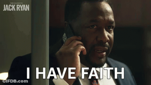 A Man In A Suit Talking On A Cell Phone With The Words I Have Faith Below Him GIF