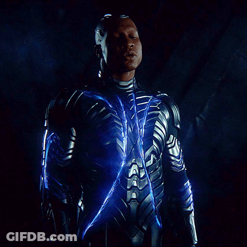A Man In A Suit With A Blue Light Coming Out Of It GIF