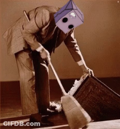 A Man In A Suit With A Box On His Head Is Sweeping The Floor . GIF