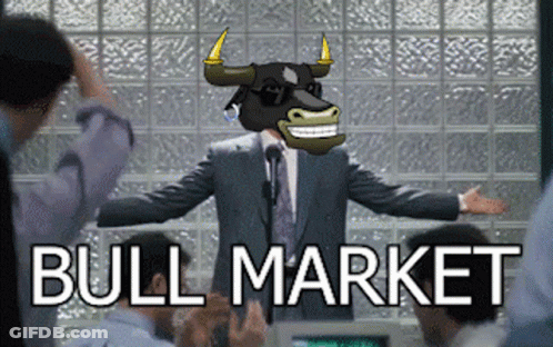 A Man In A Suit With A Bull On His Head Stands In Front Of A Group Of People With The Words Bull Market Behind Him GIF