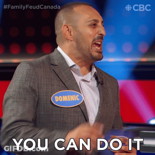 A Man In A Suit With A Name Tag That Says Domenic GIF