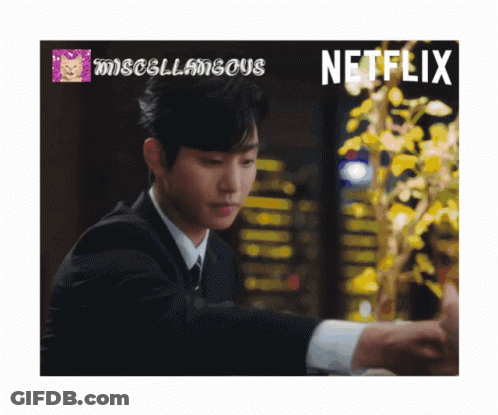A Man In A Suit With A Netflix Logo In The Corner GIF