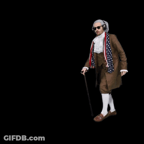 A Man In A Suit With An American Flag On It GIF