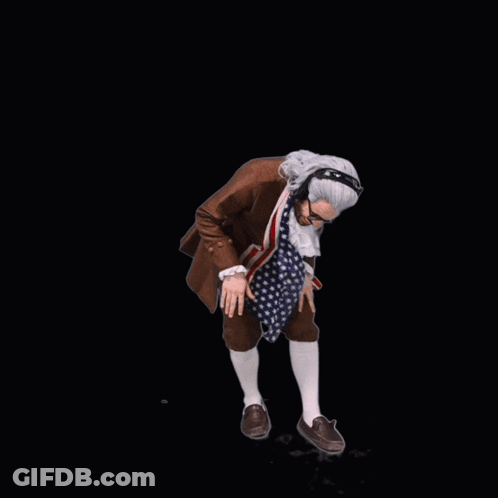 A Man In A Suit With An American Flag Scarf Around His Neck Is Wearing Headphones GIF