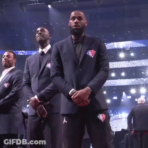 A Man In A Suit With The Nba Logo On His Jacket GIF