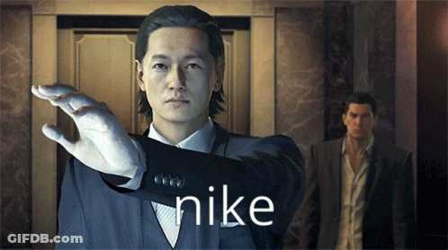 A Man In A Suit With The Word Nike On His Sleeve GIF