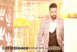 A Man In A Suit With The Words Bade Besharam Log Hain Written Above Him GIF