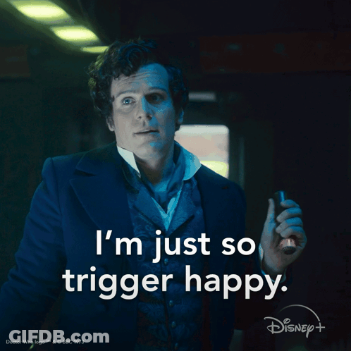 A Man In A Suit With The Words I 'M Just So Trigger Happy On The Bottom GIF